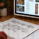 A designer sketching floral arrangements and incorporating client feedback on a mood board.